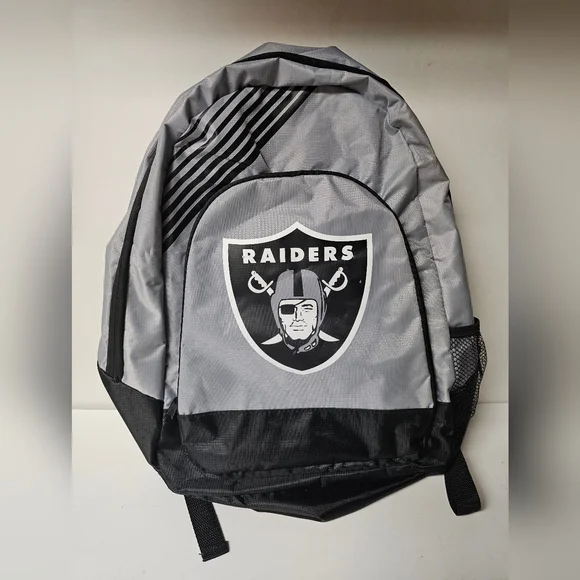 Vintage 1990's (L) Oakland Raiders Pro Line Starter Zip-Up Jacket & Backpack